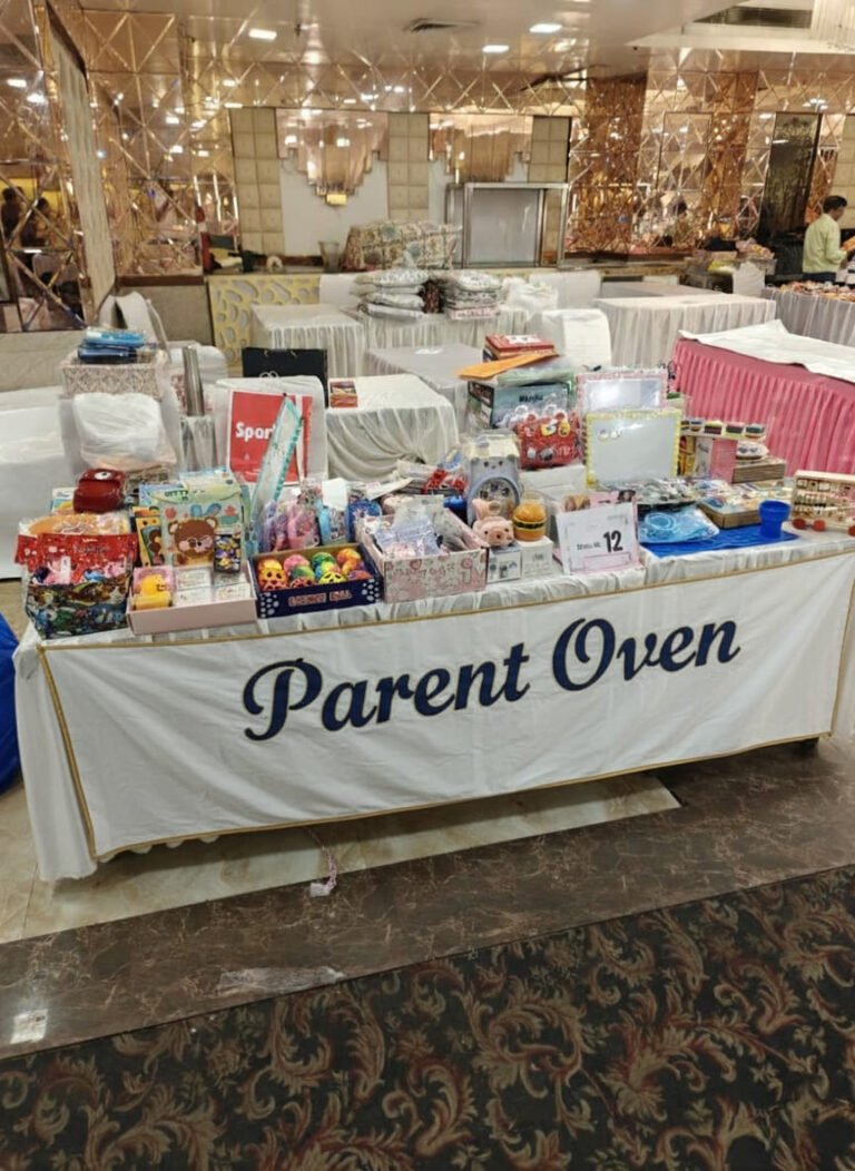 The Parent Oven stall at a kids’ shopping fair, with toys and books under a Parent Oven banner