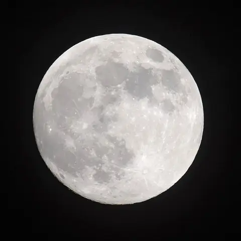 A bright full Moon in a dark sky
