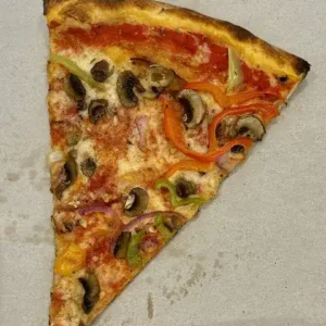 A single triangle slice of vegetable pizza