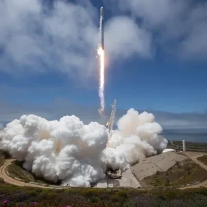 A rocket launching with a cloud of white smoke